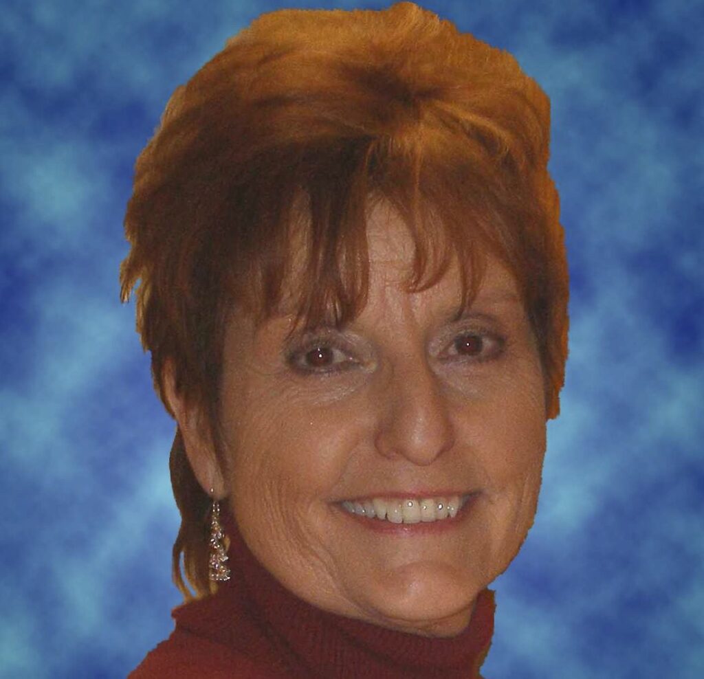 Smiling woman with short auburn hair