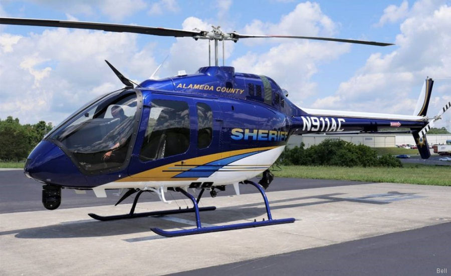 Blue Alameda County sheriff helicopter parked on tarmac
